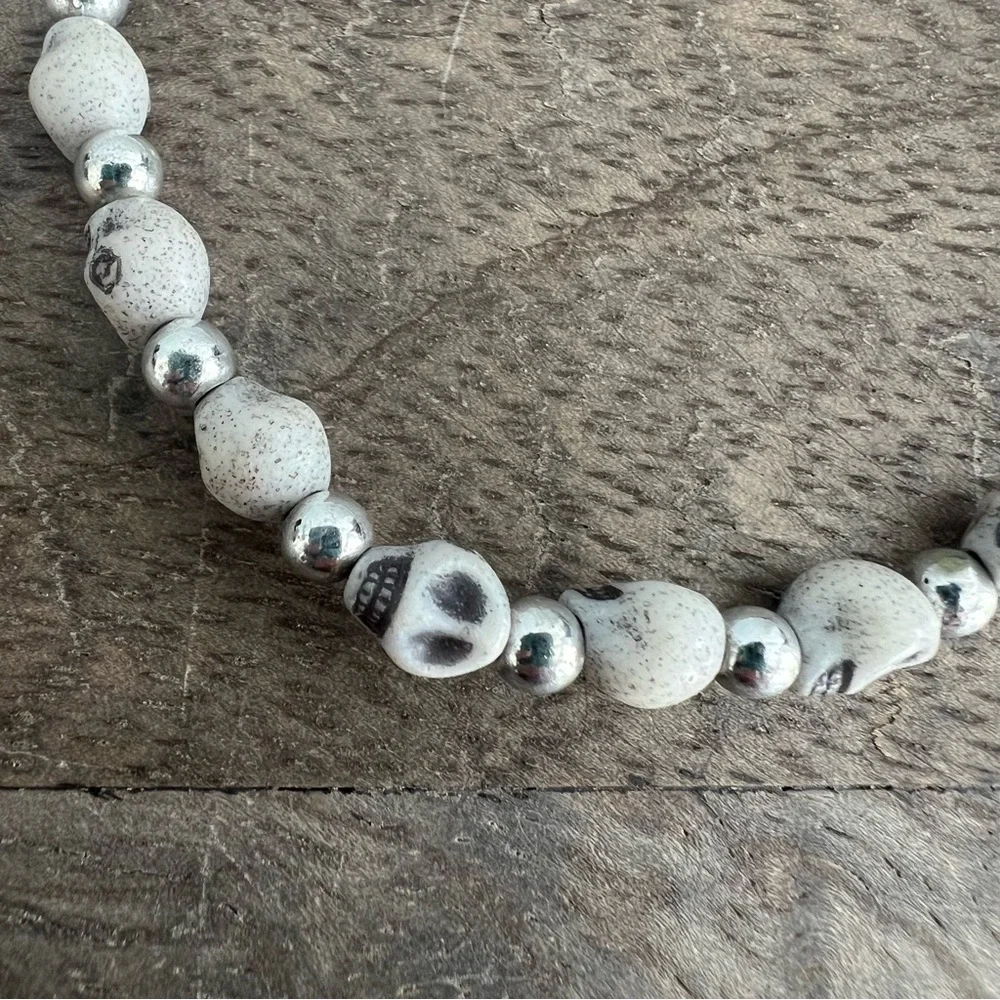 Skull face and silver tone bead stretch bracelet set